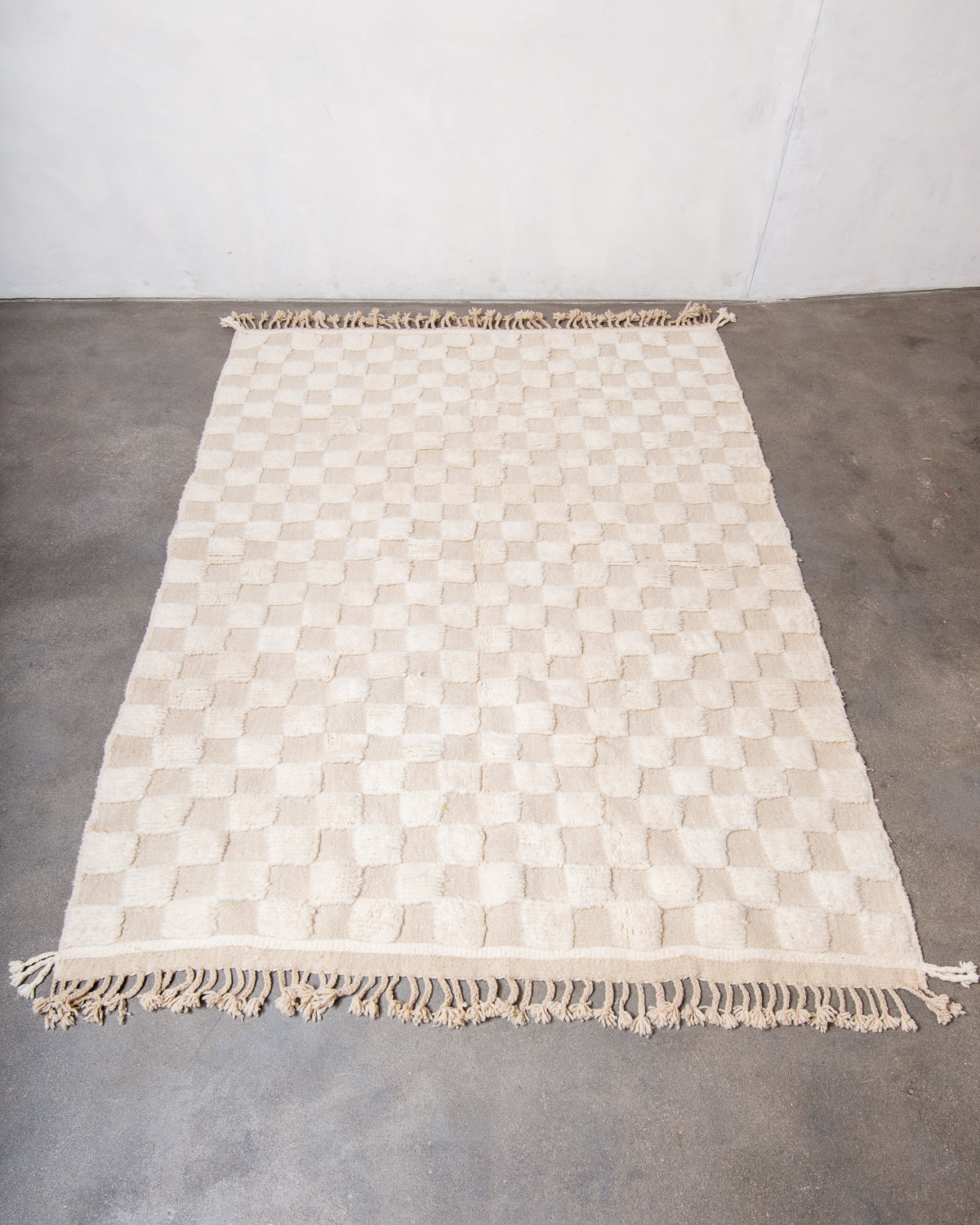 Modern, designer, handcrafted Berber rug from Morocco. Beniourain carpet with minimalist design, natural wool pile and a fluffy texture.